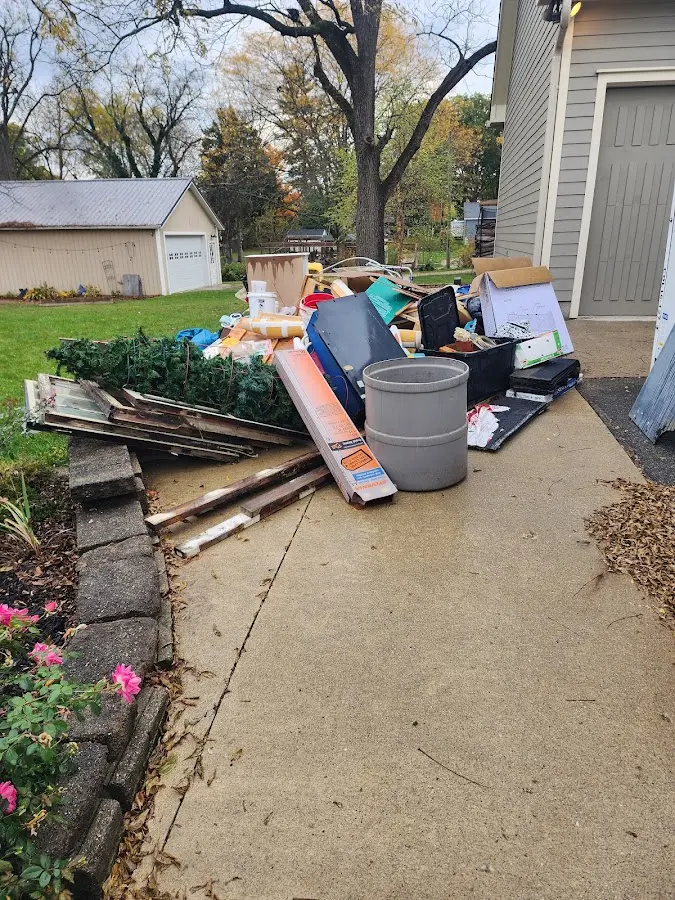 Dumpster being loaded with debris for Demolition Dumpster Rental in East Grand Rapids